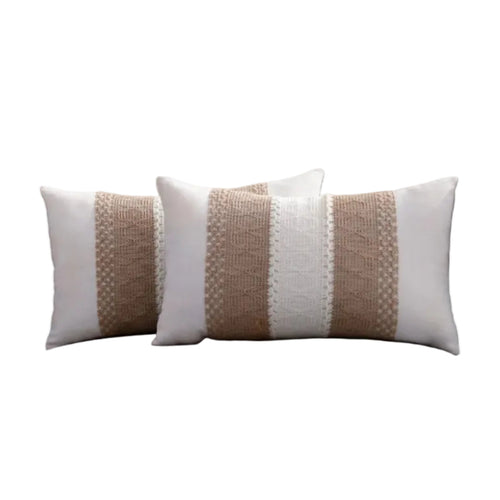 Decorative pillows with brown and white pattern on a gray sofa.